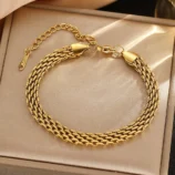 Gold stainless steel chain braided bracelet displayed in a box