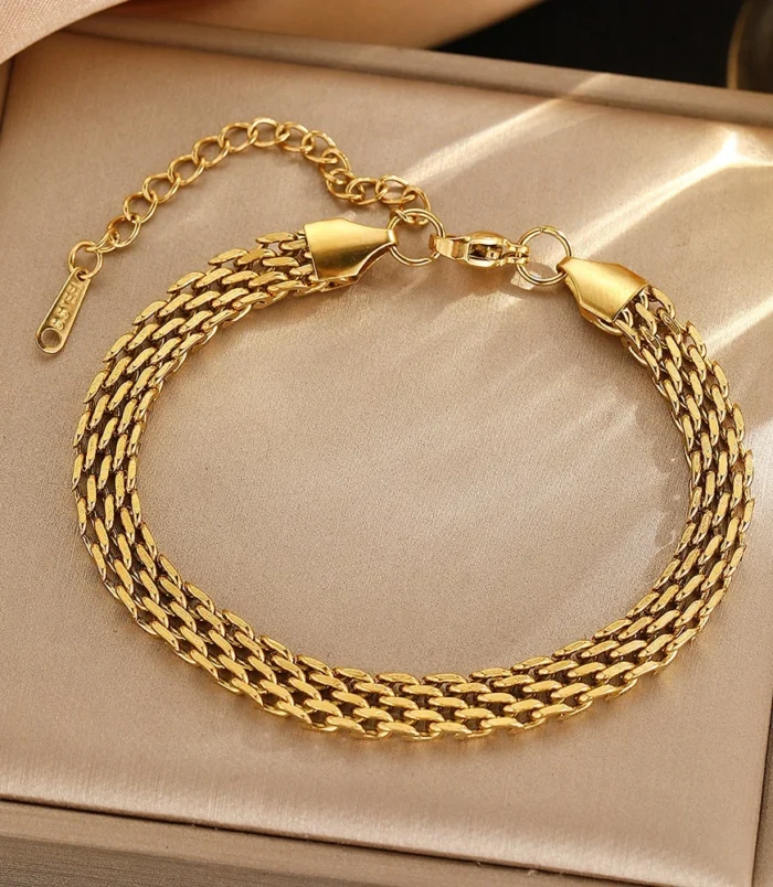 Gold stainless steel chain braided bracelet displayed in a box