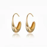 Beautiful pair of minimalist geometric earrings in gold on a white background