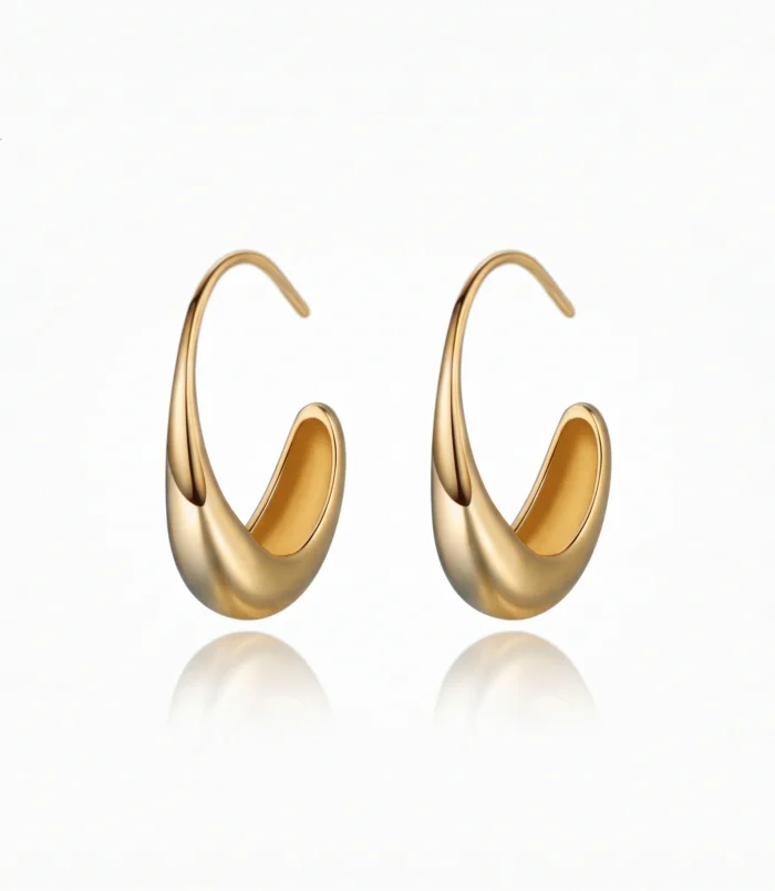 Beautiful pair of minimalist geometric earrings in gold on a white background