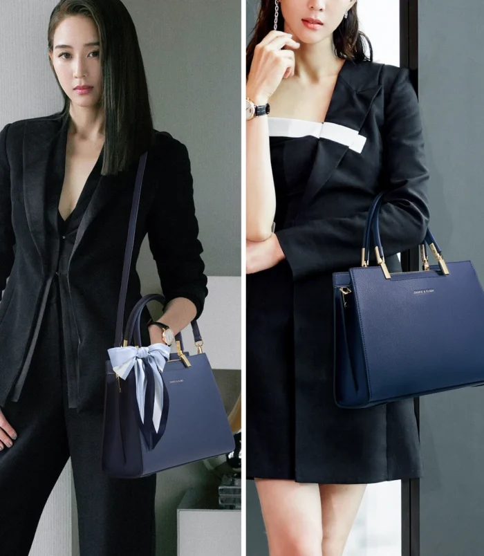 Multicolor PU leather Boston bag held by a model wearing stylish office attire.