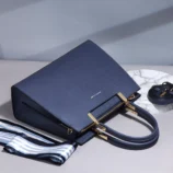 Multicolor PU leather Boston bag top down view showing the secure zipper closure.