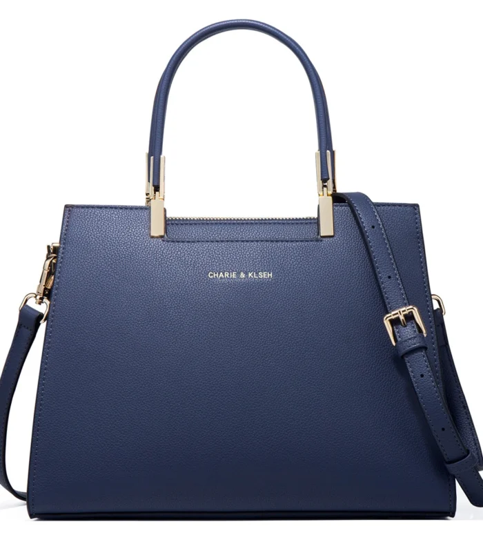 Multicolor PU leather Boston bag in dark blue viewed from the front without scarf.
