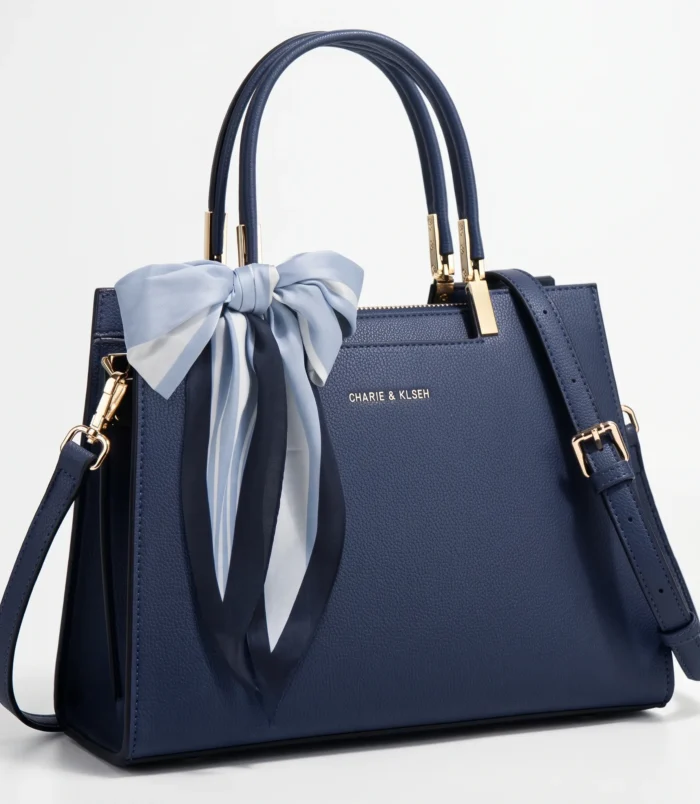 Elegant dark blue PU leather Boston bag with a decorative bow scarf.