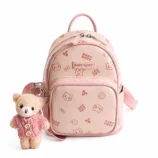 High quality pastel pink cat print backpack featuring a cute teddy bear charm.