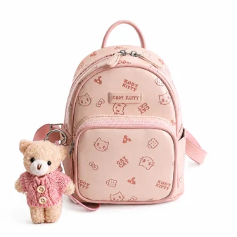 High quality pastel pink cat print backpack featuring a cute teddy bear charm.