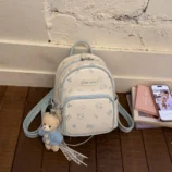 Pastel Cat Print PU Leather Backpack for Women blue style front view.