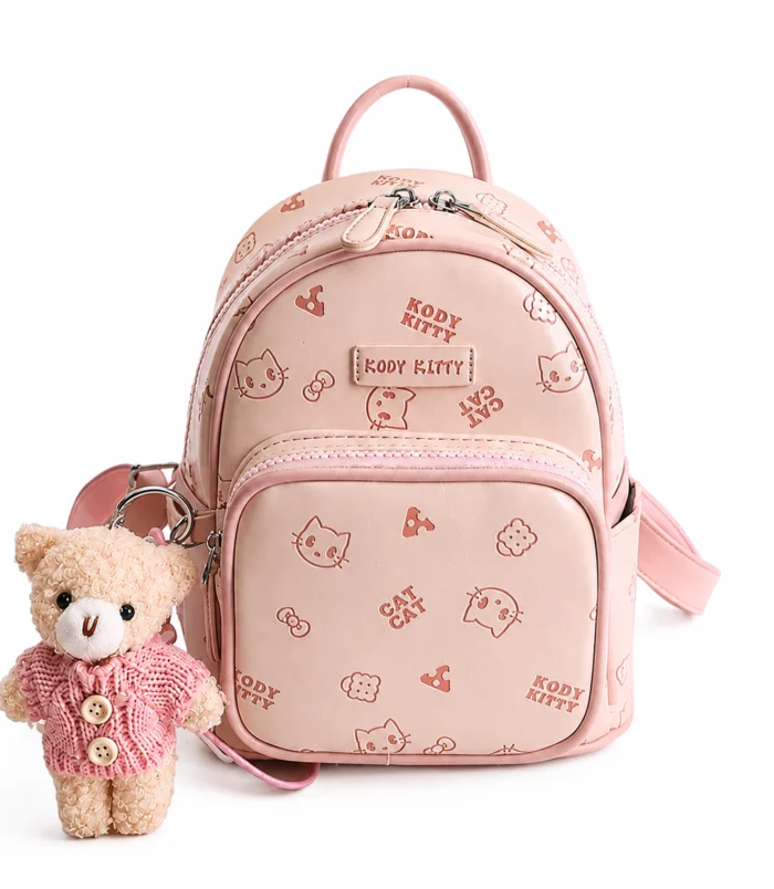 High quality pastel pink cat print backpack featuring a cute teddy bear charm.