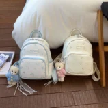 Pastel Cat Print PU Leather Backpack for Women blue and white color options side-by-side.