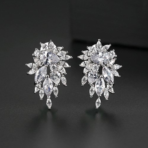 silver-zircon-earrings-women-4 Silver zircon earrings for women worn on the ear by a model looking back