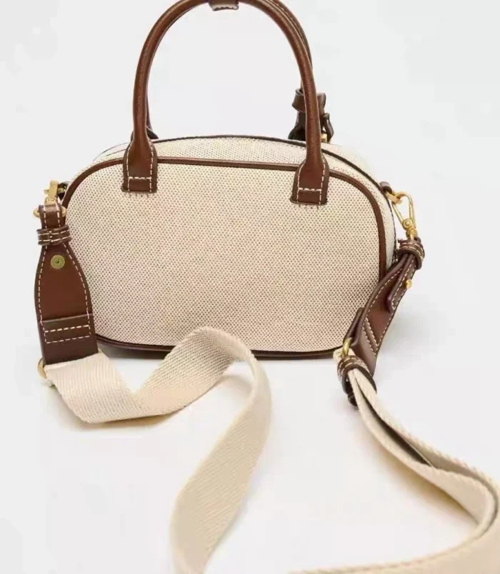 Solid PU Leather Small Square Bag featuring an alternative wide woven shoulder strap.
