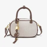 Solid PU Leather Small Square Bag in original white showcasing the decorative front charm.