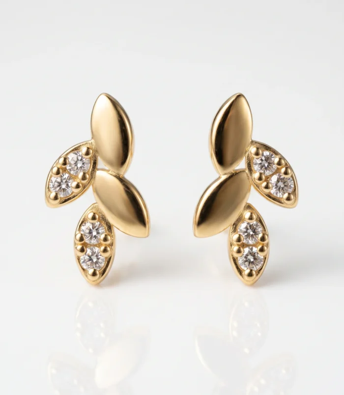 Beautiful sterling silver leaf earrings in gold color front view.