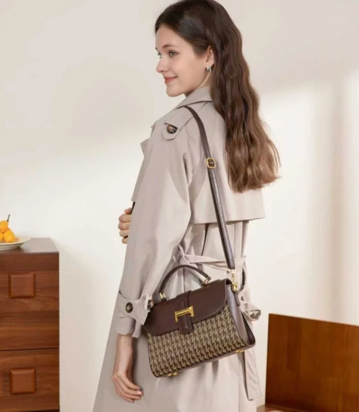 Black and Brown Vintage Houndstooth Handbag for Women - worn on shoulder.