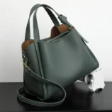 Classic Soft PU Leather Tote Bag for Women angled side view in elegant green.