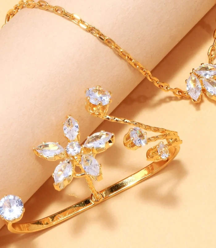 Elegant zircon flower finger bracelet close-up view of the sparkling floral ring details.