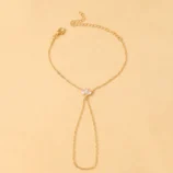 Gold and Silver Rhinestone Leaf Finger Bracelet for Women laid flat showing the full chain design.