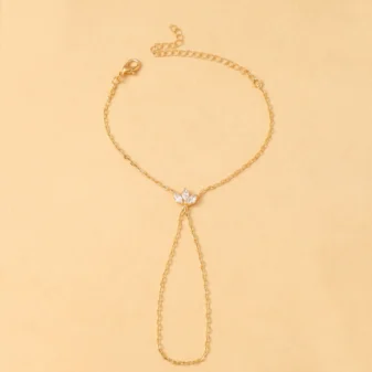 Gold and Silver Rhinestone Leaf Finger Bracelet for Women laid flat showing the full chain design.