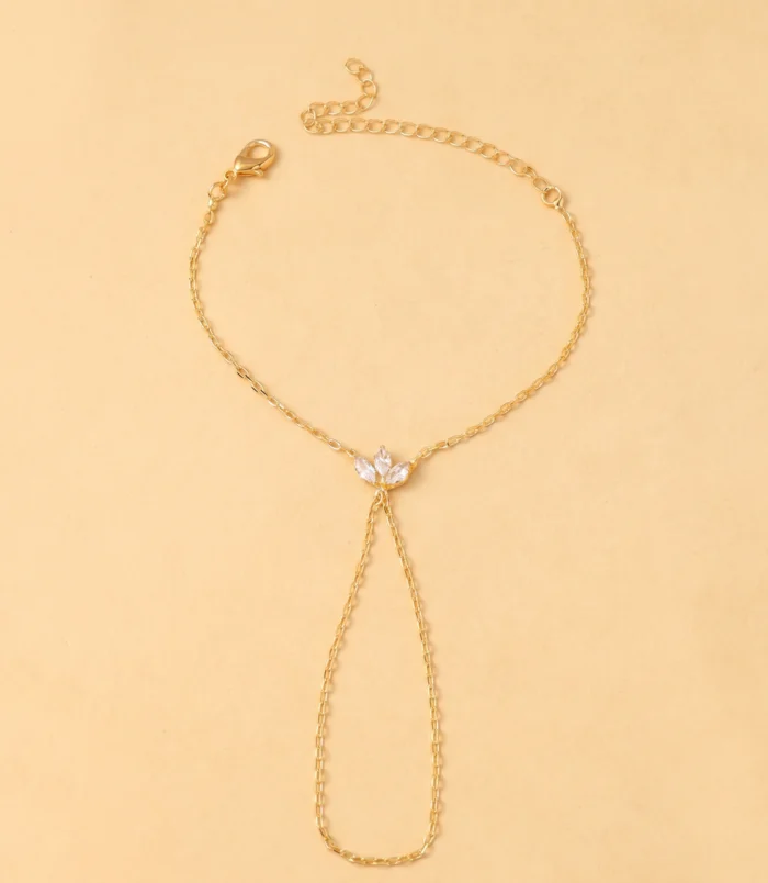 Gold and Silver Rhinestone Leaf Finger Bracelet for Women laid flat showing the full chain design.