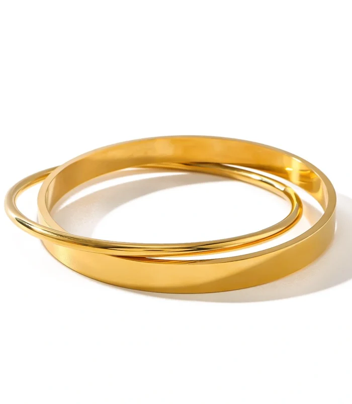 Gold Double Loop Bracelet in Stainless Steel placed flat on a clean white surface.