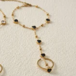 Gold-Plated Stainless Steel Heart Finger Bracelet close-up view of the black gemstone chain