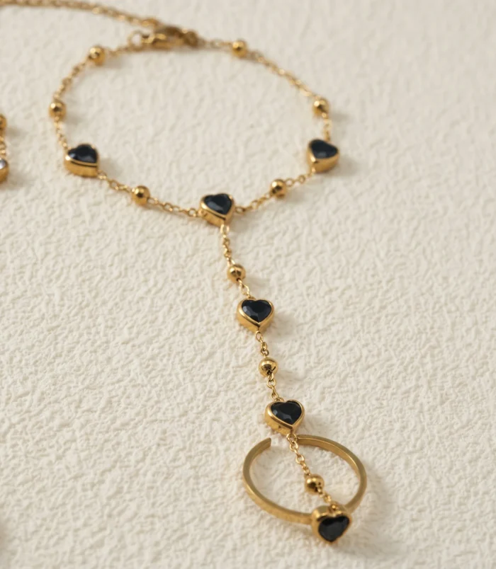 Gold-Plated Stainless Steel Heart Finger Bracelet close-up view of the black gemstone chain