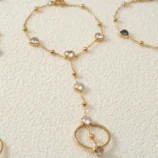 Gold-Plated Stainless Steel Heart Finger Bracelet close-up view of the white gemstone chain