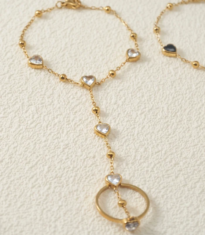 Gold-Plated Stainless Steel Heart Finger Bracelet close-up view of the white gemstone chain