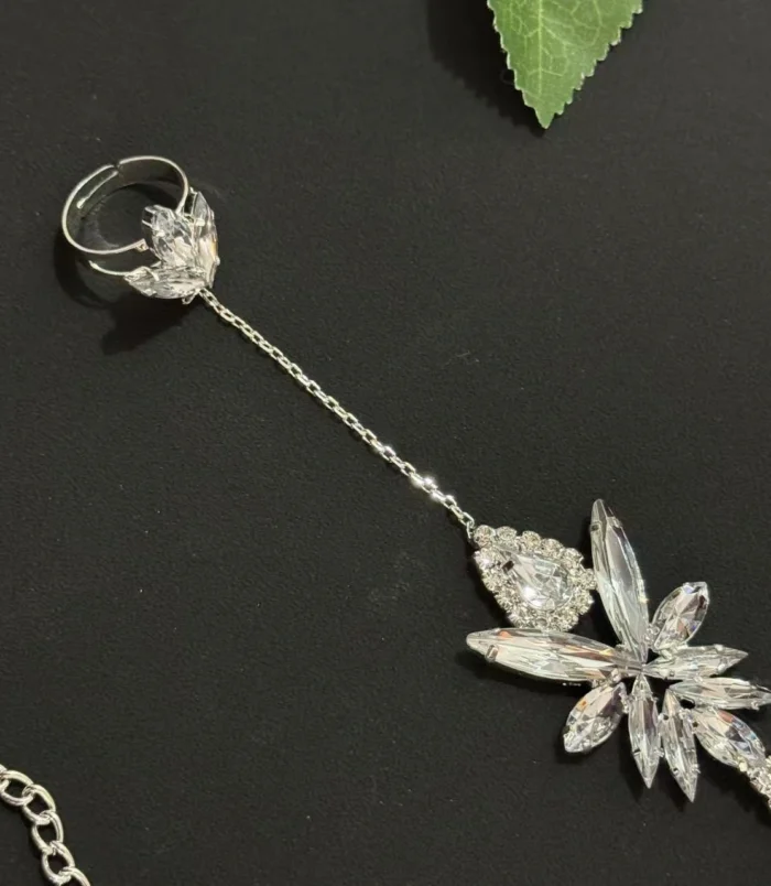 Gold & Silver Rhinestone Leaf Finger Bracelet silver close-up of ring and crystals.