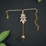 Gold & Silver Rhinestone Leaf Finger Bracelet gold flat lay view on dark background.