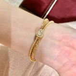 Gold & Silver Wire Wrapped Bracelet close-up view worn on wrist showing the sparkling center.