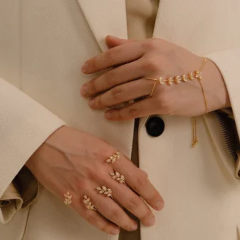 Gold & Silver Zircon Leaf Finger Bracelet for Women worn gracefully by a model.