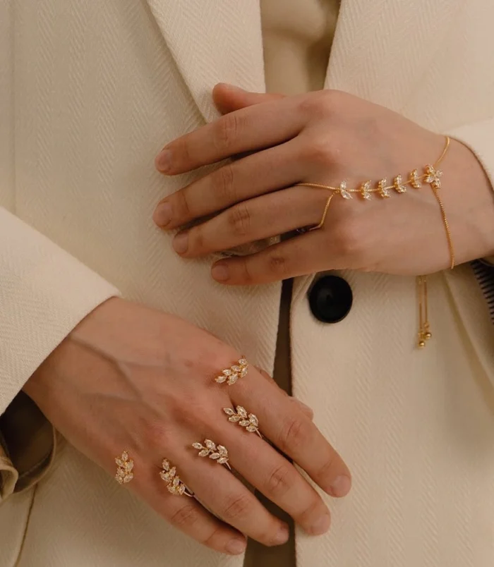 Gold & Silver Zircon Leaf Finger Bracelet for Women worn gracefully by a model.