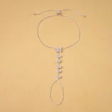 Gold & Silver Zircon Leaf Finger Bracelet for Women silver variant laid completely flat.