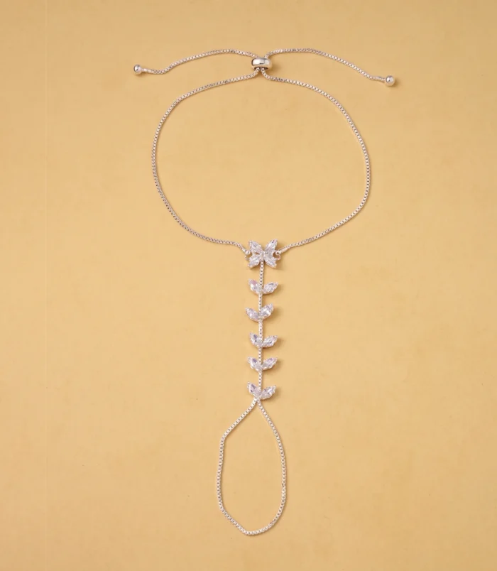 Gold & Silver Zircon Leaf Finger Bracelet for Women silver variant laid completely flat.