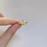 Gold Teardrop Zircon Ring worn on hand highlighting the curved band design.