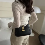Minimalist PU Leather Baguette Bag for Women worn on shoulder.