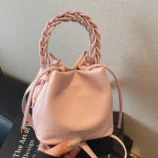 Multi-Colour Woven Handle Bucket Bag for Women in pink highlighting the drawstring detailing