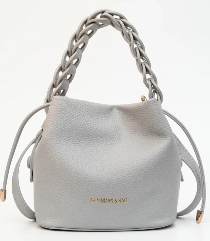 Elegant light blue woven handle bucket bag with stylish drawstring closure