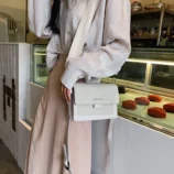 Multicolour PU leather square crossbody bag in white side profile view