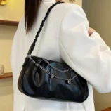 Pleated Chain Shoulder Bag for Women worn on shoulder in black.