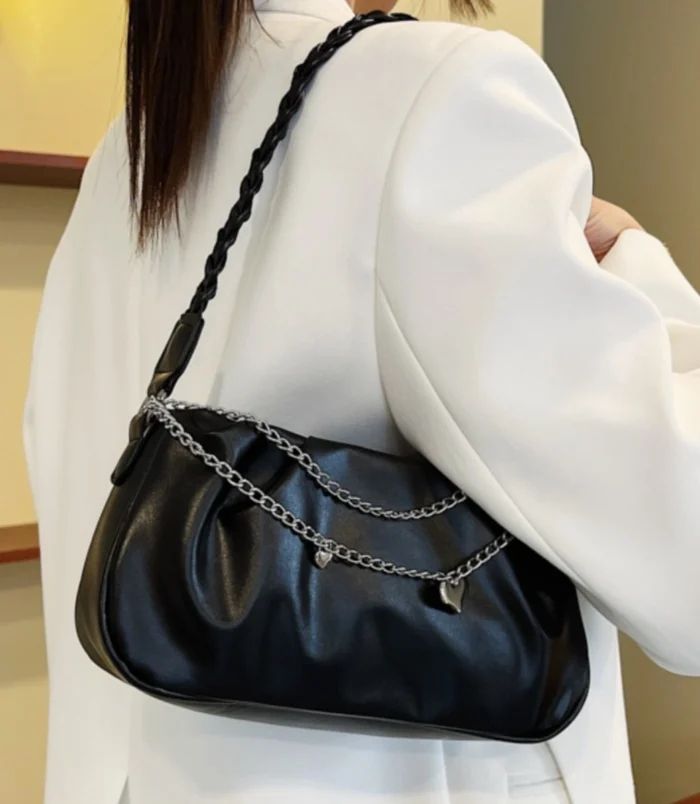 Pleated Chain Shoulder Bag for Women worn on shoulder in black.