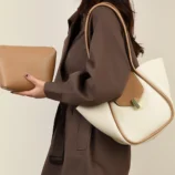 Classic PU Leather Bucket Bag for Women in two-tone apricot worn by model