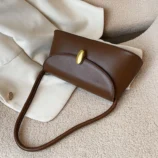 Top angle view of the light brown shoulder bag laying flat