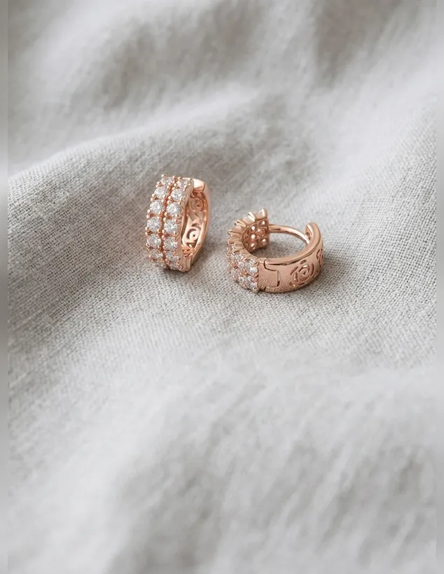 Rose gold huggie earrings with two rows of clear zircon stones
