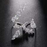 Silver Zircon Leaf Open Ring for Women top view resting on a surface