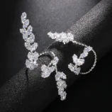 Silver Zircon Leaf Open Ring for Women displayed on a dark cylinder