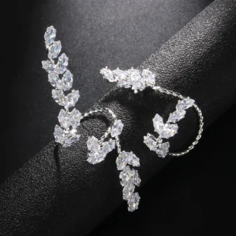 silver-zircon-leaf-open-ring-for-women-4 Silver Zircon Leaf Open Ring for Women displayed on a dark cylinder