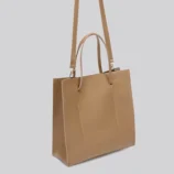 Solid Colour PU Leather Tote Bag for Women showing the shoulder strap and side stitching.