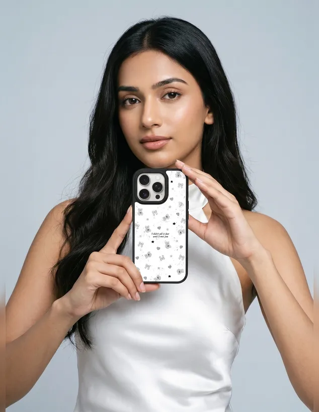 Woman holding a phone with a teddy bear pattern case